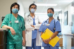 3 Healthcare Professionals Hallway_wearing masks_small