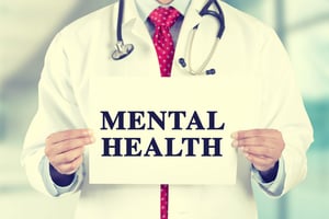 Physician Holding Mental Health Sign