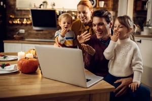 Family celebrating virtual holiday_small