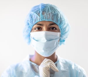 Female healthcare worker wearing mask and gown_small