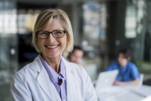 Happy female doctor in hospital