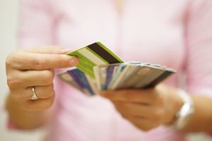 woman choose one credit card, concept of credit debt