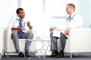 Two doctors sitting and talking