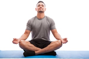 Male athlete meditating