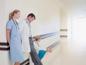 Medical team leaning on wall_small