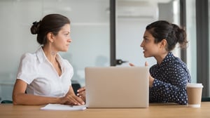 Two woman talking in an office_small