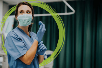 Woman in PPE putting gloves on Green Brushstroke (flipped horizontally)