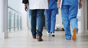 hospital employees waist down walking away small-1