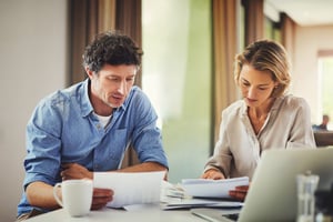 middle age couple reviewing finances_small